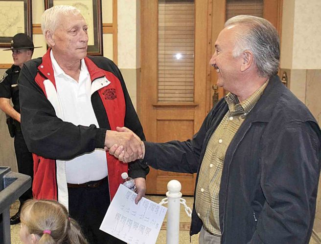 Incumbent Delegate John Kelly, R-10th, of Wood County, congratulates Delegate-elect Republican Vernon Criss, right, on Tuesday night. Kelly, Criss and incumbent Republican Frank Deem will represent Wood County's 10th Delegate District in the West Virginia House of Delegates following Tuesday's unofficial election totals. (Photo by Brett Dunlap)